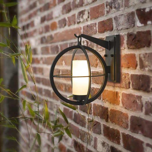1 Bulb Cylinder Sconce Rural Black Frosted Glass Wall Lighting Fixture with Global Metal Cage Clearhalo 'Wall Lamps & Sconces' 'Wall Lights' Lighting' 819901