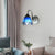 1 Head Living Room Sconce Light Fixture Mediterranean White Wall Lamp with Pyramid Blue Glass Shade Blue Clearhalo 'Industrial' 'Middle century wall lights' 'Tiffany wall lights' 'Tiffany' 'Wall Lamps & Sconces' 'Wall Lights' Lighting' 86131