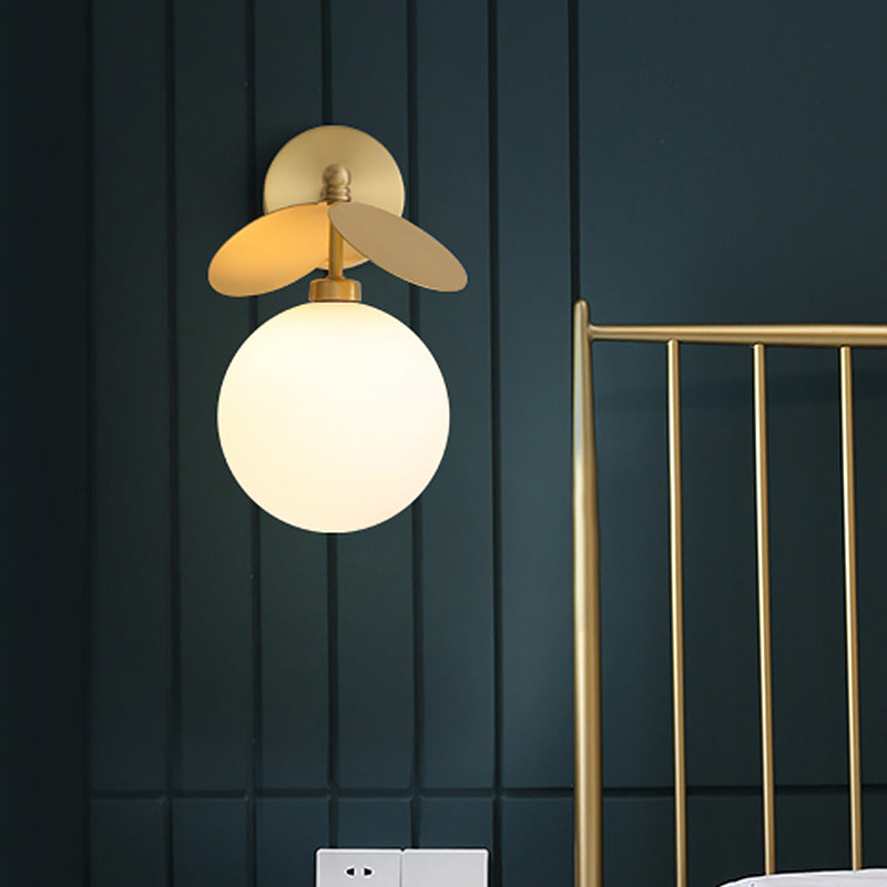 Post Modern Globe/Oval Wall Mount Lamp Cream Glass 1 Light Bedside Wall Light in Brass with Leaf Deco Brass Globe Clearhalo 'Cast Iron' 'Glass' 'Industrial' 'Modern wall lights' 'Modern' 'Tiffany' 'Traditional wall lights' 'Wall Lamps & Sconces' 'Wall Lights' Lighting' 875283