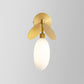 Post Modern Globe/Oval Wall Mount Lamp Cream Glass 1 Light Bedside Wall Light in Brass with Leaf Deco Clearhalo 'Cast Iron' 'Glass' 'Industrial' 'Modern wall lights' 'Modern' 'Tiffany' 'Traditional wall lights' 'Wall Lamps & Sconces' 'Wall Lights' Lighting' 875290