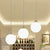 White/Black Waterdrop Multiple Hanging Light 3-Bulb Clear and Opal Glass Pendant Lamp with Linear Canopy White Clearhalo 'Ceiling Lights' 'Glass shade' 'Glass' 'Modern Pendants' 'Modern' 'Pendant Lights' 'Pendants' Lighting' 875486