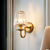 Modern Cone Wall Light Fixture 1 Head K9 Crystal Wall Sconce in Gold with Arched Arm Gold Clearhalo 'Cast Iron' 'Glass' 'Industrial' 'Modern wall lights' 'Modern' 'Tiffany' 'Traditional wall lights' 'Wall Lamps & Sconces' 'Wall Lights' Lighting' 885942