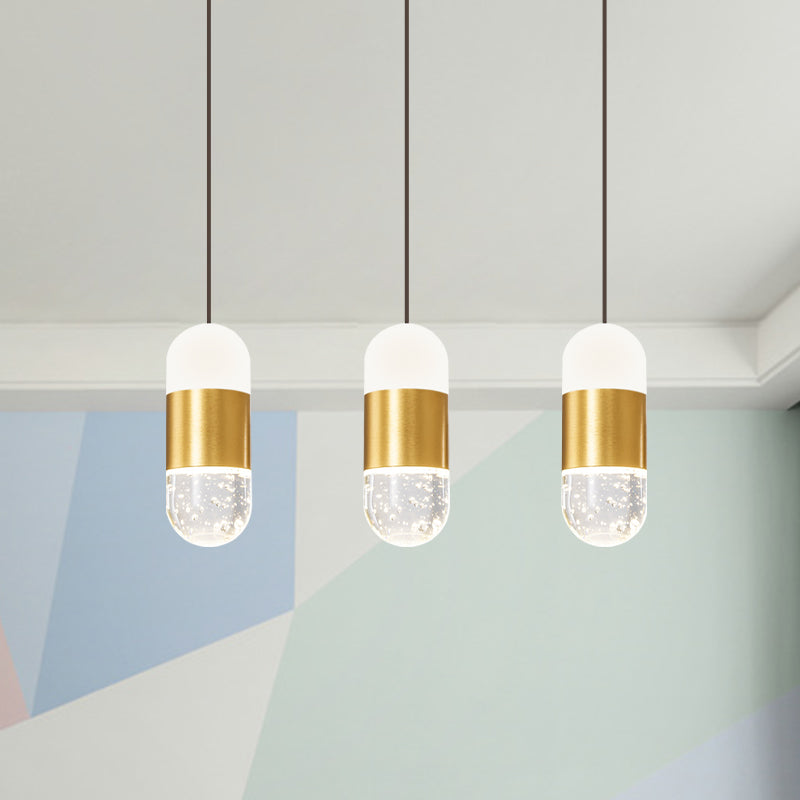 Brass 3-Head Cluster Pendant Minimalist Seedy Crystal Capsule Hanging Ceiling Light for Dining Room Brass Clearhalo 'Ceiling Lights' 'Modern Pendants' 'Modern' 'Pendant Lights' 'Pendants' Lighting' 886251