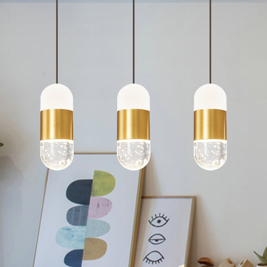 Brass 3-Head Cluster Pendant Minimalist Seedy Crystal Capsule Hanging Ceiling Light for Dining Room Clearhalo 'Ceiling Lights' 'Modern Pendants' 'Modern' 'Pendant Lights' 'Pendants' Lighting' 886252