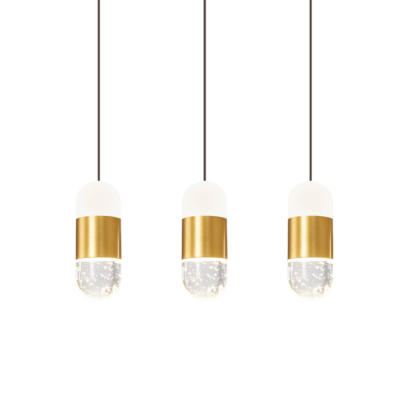 Brass 3-Head Cluster Pendant Minimalist Seedy Crystal Capsule Hanging Ceiling Light for Dining Room Clearhalo 'Ceiling Lights' 'Modern Pendants' 'Modern' 'Pendant Lights' 'Pendants' Lighting' 886253