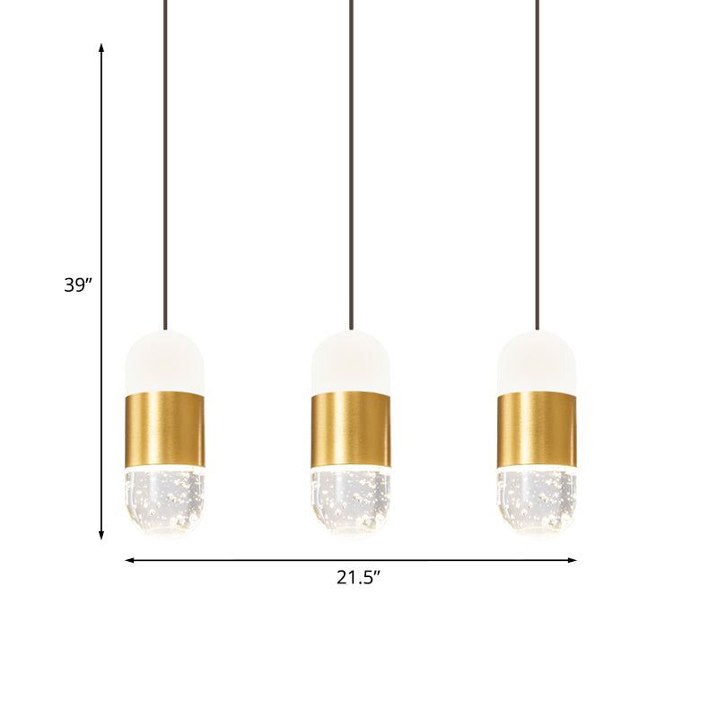 Brass 3-Head Cluster Pendant Minimalist Seedy Crystal Capsule Hanging Ceiling Light for Dining Room Clearhalo 'Ceiling Lights' 'Modern Pendants' 'Modern' 'Pendant Lights' 'Pendants' Lighting' 886254