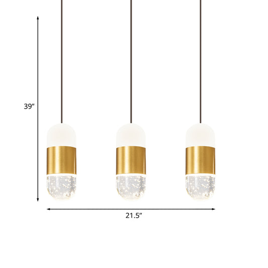 Brass 3-Head Cluster Pendant Minimalist Seedy Crystal Capsule Hanging Ceiling Light for Dining Room Clearhalo 'Ceiling Lights' 'Modern Pendants' 'Modern' 'Pendant Lights' 'Pendants' Lighting' 886254