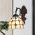 Domed Cut Glass Wall Lighting Ideas Baroque 1 Light Bronze Gem Patterned Sconce Light Fixture with Swirl Arm Bronze Clearhalo 'Art deco wall lights' 'Cast Iron' 'Glass' 'Industrial' 'Middle century wall lights' 'Modern' 'Tiffany wall lights' 'Tiffany' 'Traditional wall lights' 'Wall Lamps & Sconces' 'Wall Lights' Lighting' 890254