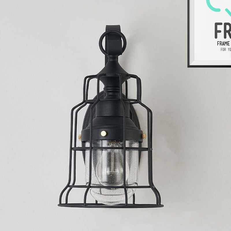 1 Light Bell Shade Sconce Light Industrial Black Seedy Glass Wall Lamp for Corridor with Metal Cage Frame Clearhalo 'Art deco wall lights' 'Cast Iron' 'Glass' 'Industrial wall lights' 'Industrial' 'Middle century wall lights' 'Modern' 'Rustic wall lights' 'Tiffany' 'Traditional wall lights' 'Wall Lamps & Sconces' 'Wall Lights' Lighting' 968863