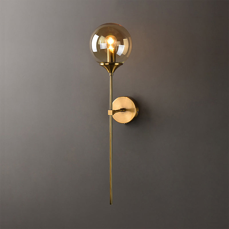 Modern Globe Shade Wall Lighting Single Bulb Clear/Grey/Amber Glass Sconce Light in Brass for Bedroom Clearhalo 'Art deco wall lights' 'Cast Iron' 'Glass' 'Industrial wall lights' 'Industrial' 'Middle century wall lights' 'Modern' 'Rustic wall lights' 'Tiffany' 'Traditional wall lights' 'Wall Lamps & Sconces' 'Wall Lights' Lighting' 968939