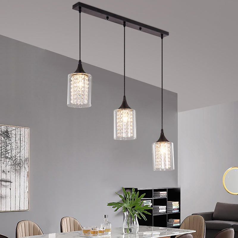 Clear Glass Cylinder Multiple Hanging Light Minimalist 3-Light Black Pendulum Lamp with Linear/Round Canopy Clearhalo 'Ceiling Lights' 'Close To Ceiling Lights' 'Glass shade' 'Glass' 'Modern Pendants' 'Modern' 'Pendant Lights' 'Pendants' Lighting' 982677