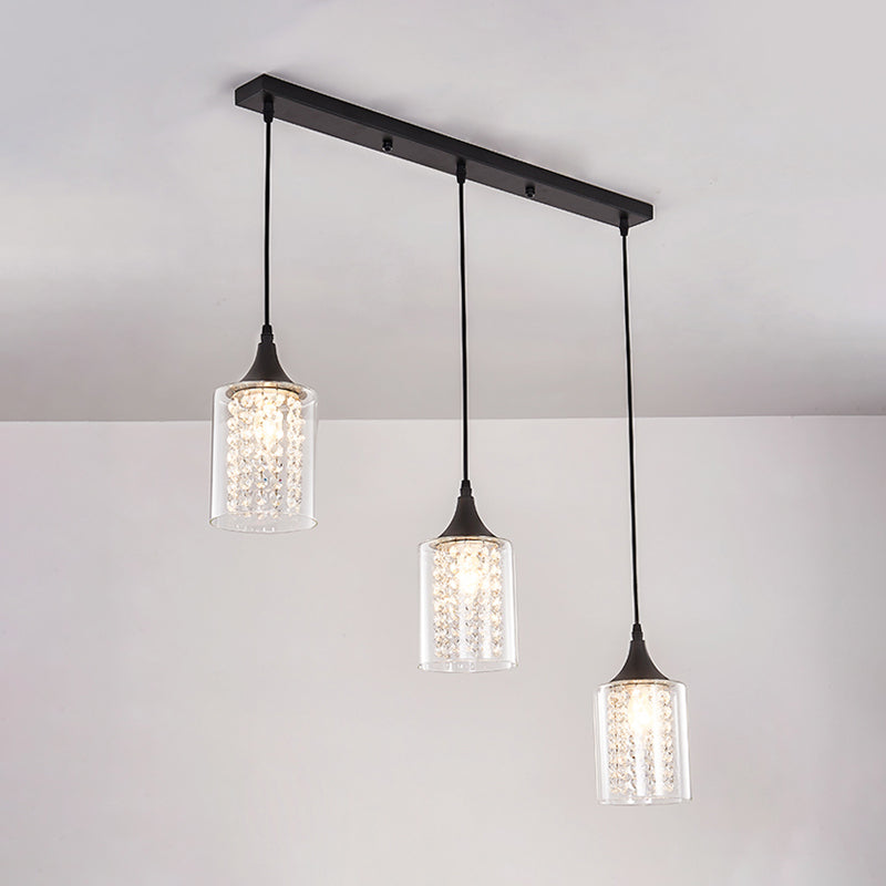 Clear Glass Cylinder Multiple Hanging Light Minimalist 3-Light Black Pendulum Lamp with Linear/Round Canopy Clearhalo 'Ceiling Lights' 'Close To Ceiling Lights' 'Glass shade' 'Glass' 'Modern Pendants' 'Modern' 'Pendant Lights' 'Pendants' Lighting' 982678