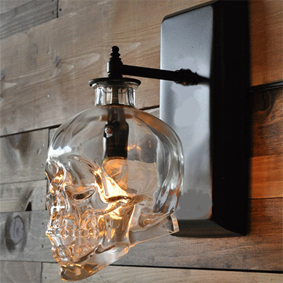Clear Glass Skull Shaped Wall Sconce Modern 1 Light Living Room Lighting Fixture in Black Clearhalo 'Art deco wall lights' 'Cast Iron' 'Glass' 'Industrial wall lights' 'Industrial' 'Middle century wall lights' 'Modern' 'Rustic wall lights' 'Tiffany' 'Traditional wall lights' 'Wall Lamps & Sconces' 'Wall Lights' Lighting' retr